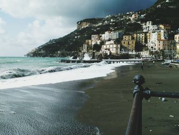 Scenic view of beach against sky in city