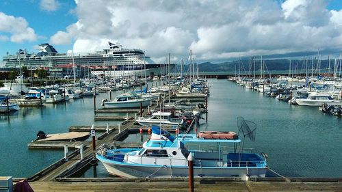 Boats moored at harbor