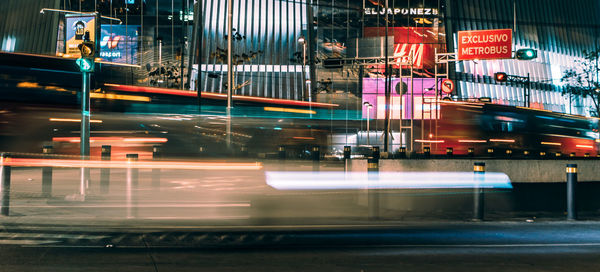 Light trails on road in city at night