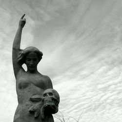 Low angle view of statue against sky