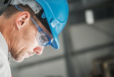 Close-up of worker wearing hardhat