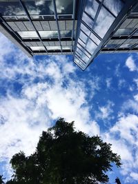 Low angle view of building against cloudy sky