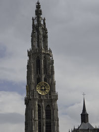 Low angle view of clock tower against sky