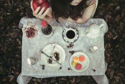 High angle view of woman holding ice cream