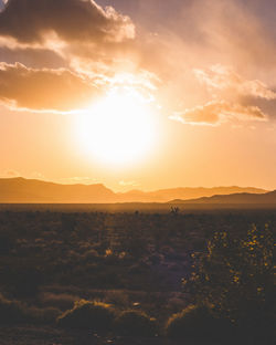 Scenic view of silhouette landscape against sky during sunset