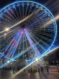 Low angle view of illuminated ferris wheel