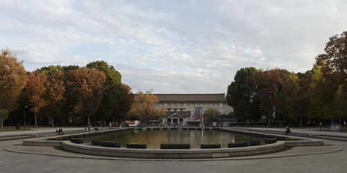 Fountain in park with city in background