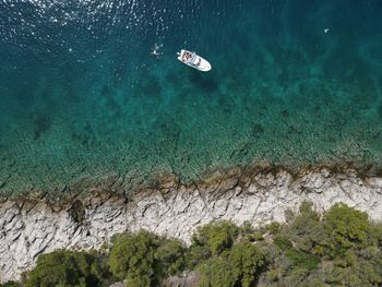 High angle view of rocks in sea