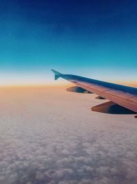 Airplane wing against sky