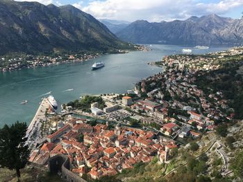 Aerial view of town by sea and mountains