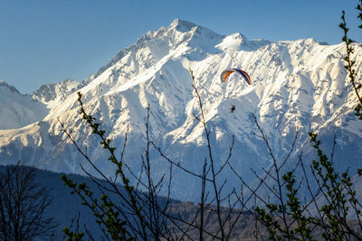 Scenic view of snowcapped mountains against clear sky