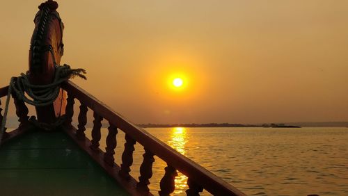 Scenic view of sea against orange sky