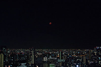 Aerial view of illuminated buildings at night