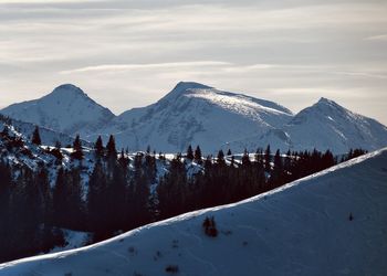 Scenic view of snowcapped mountains against sky