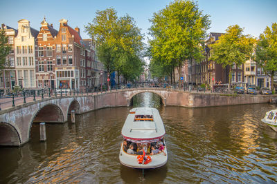 View of bridge over canal in city