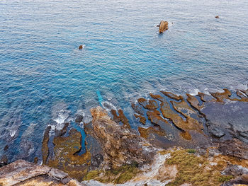 High angle view of rock formation in sea