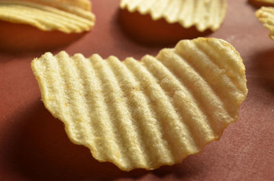 Close-up of potato chips on table