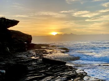 Scenic view of sea against sky during sunset