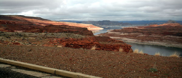 Scenic view of lake and mountains against sky