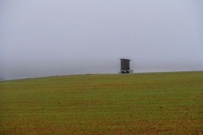 Scenic view of field against clear sky