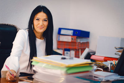 Portrait of businesswoman working in office