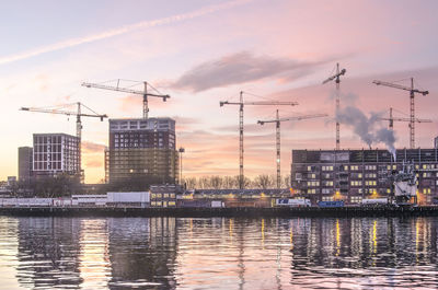 Rotterdam grain silo and construction cranes at sunrise