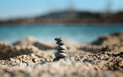 Close-up of stacked pebbles at beach