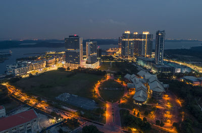 High angle view of illuminated buildings in city at night