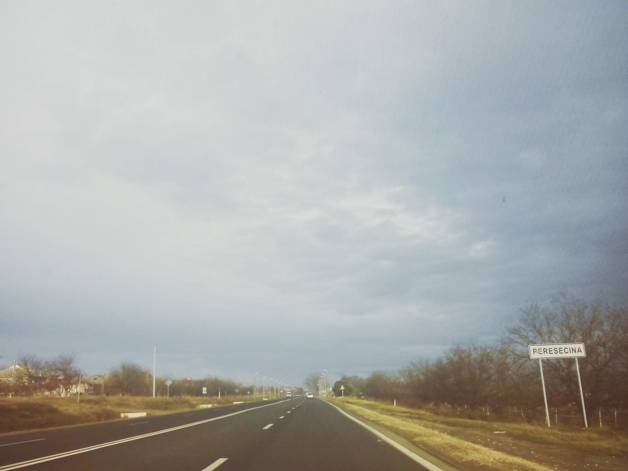 transportation, the way forward, road, road marking, diminishing perspective, vanishing point, sky, country road, highway, empty road, car, cloud - sky, street, empty, dividing line, asphalt, outdoors, no people, nature, land vehicle