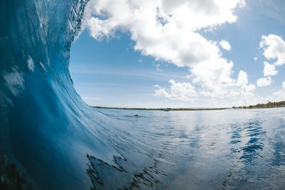 Wave in sea against sky