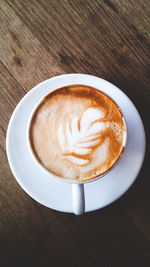 High angle view of cappuccino on table