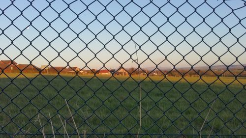 Chainlink fence against sky