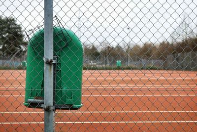 Close-up of chainlink fence against sky