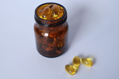 High angle view of glass of jar on table