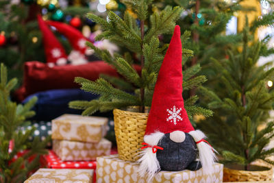 Little santa claus toy, close up. traditional doll for christmas under the tree.