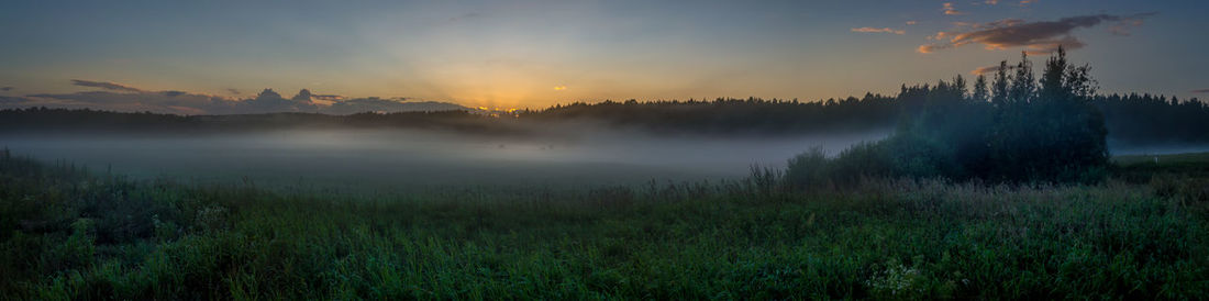 Panoramic shot of land against sky during sunset