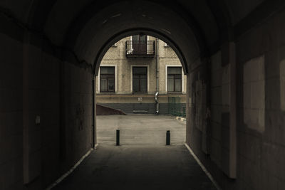 Archway leading towards street in city