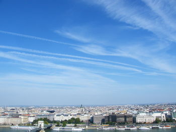 High angle shot of townscape against blue sky