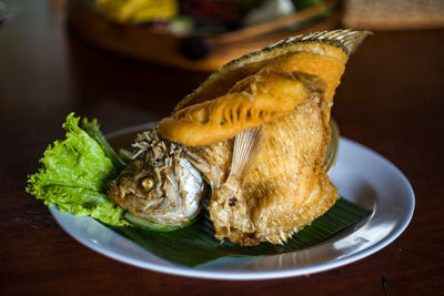 Close-up of fish served in plate on table