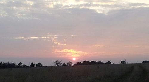 Scenic view of landscape at sunset