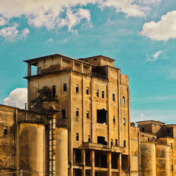 Low angle view of old building against sky