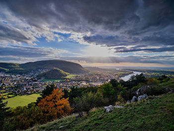 Hainburg city and danube river view from braunsberg mountain in sunset, austria