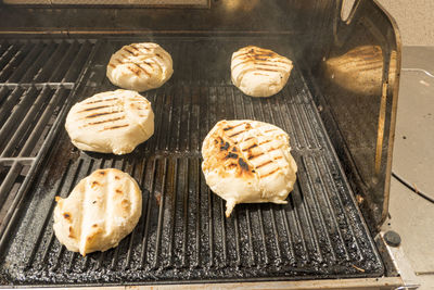 High angle view of bread on barbecue grill
