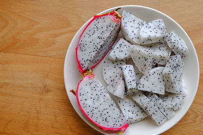 High angle view of fruit in plate on table