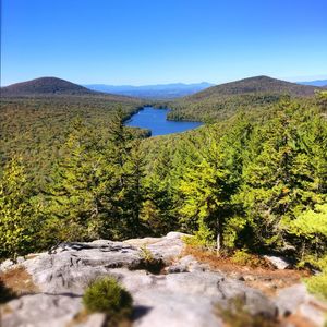 Scenic view of mountains against clear blue sky