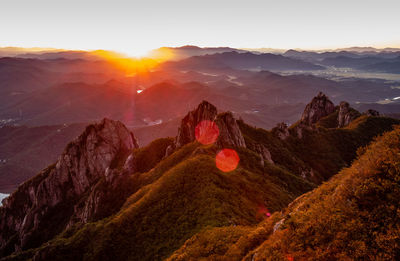 Scenic view of mountains against sky during sunset