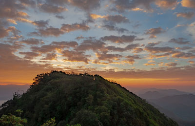 Scenic view of mountains against sky at sunset