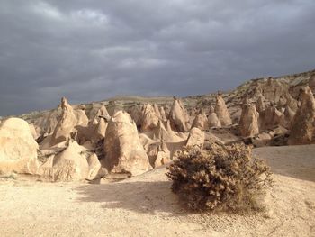 Rock formations in desert against sky