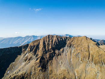 Aerial view of mountains against sky