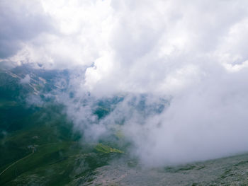 Scenic view of clouds over landscape against sky